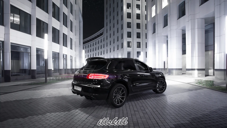 Чёрный Porsche Cayenne с графитовыми дисками, вид сзади сбоку